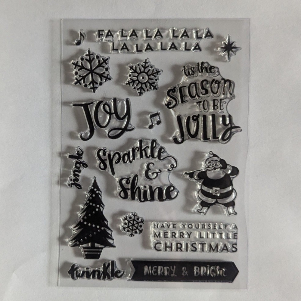 Christmas stamp set with Santa Claus, tree, snowflakes, and lots of sentiments